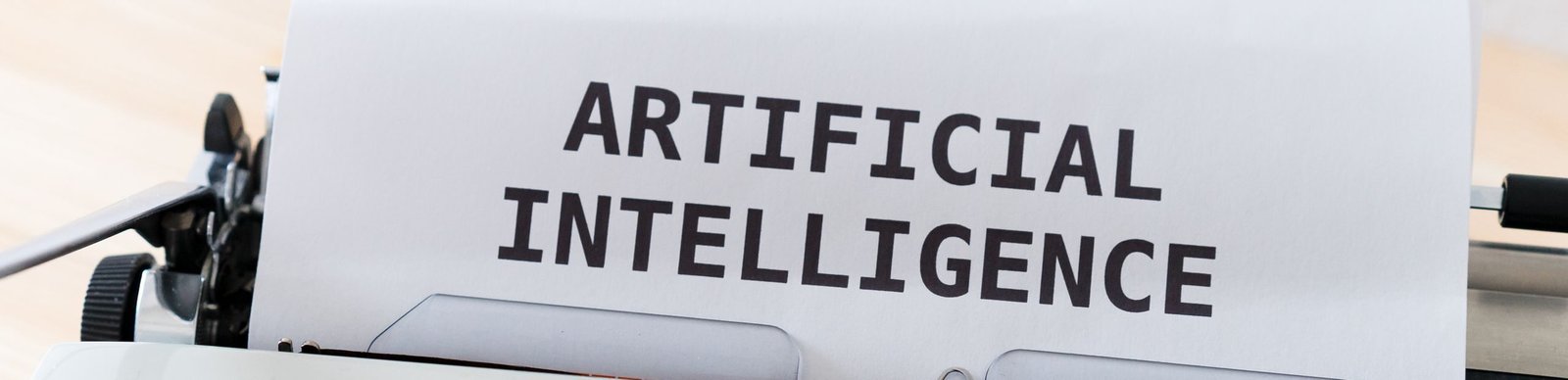 A close-up of a typewriter showcasing 'ARTIFICIAL INTELLIGENCE' on paper.