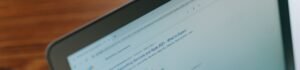 A close-up view of a laptop displaying a search engine page.