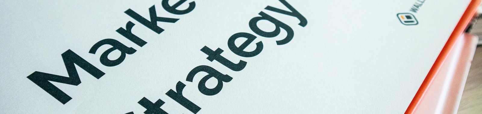 Close-up of a marketing strategy document on a desk, ideal for business content.